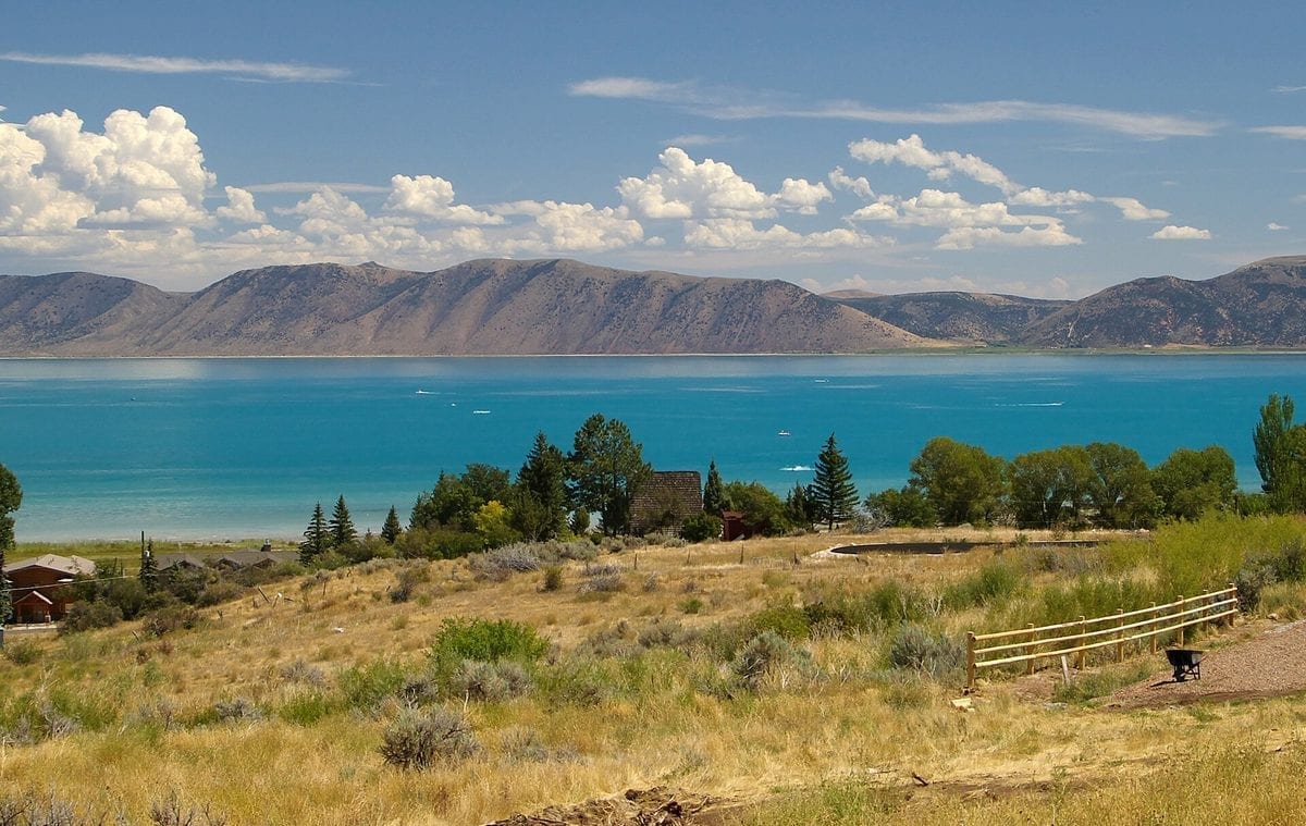 The turquoise-blue water of Bear Lake on the Utah-Idaho border under a clear sky