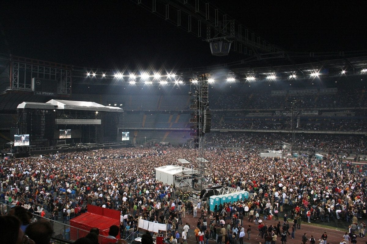 A packed Stadio delle Alpi football stadium in Turin, Italy, seen from the stands with a full crowd