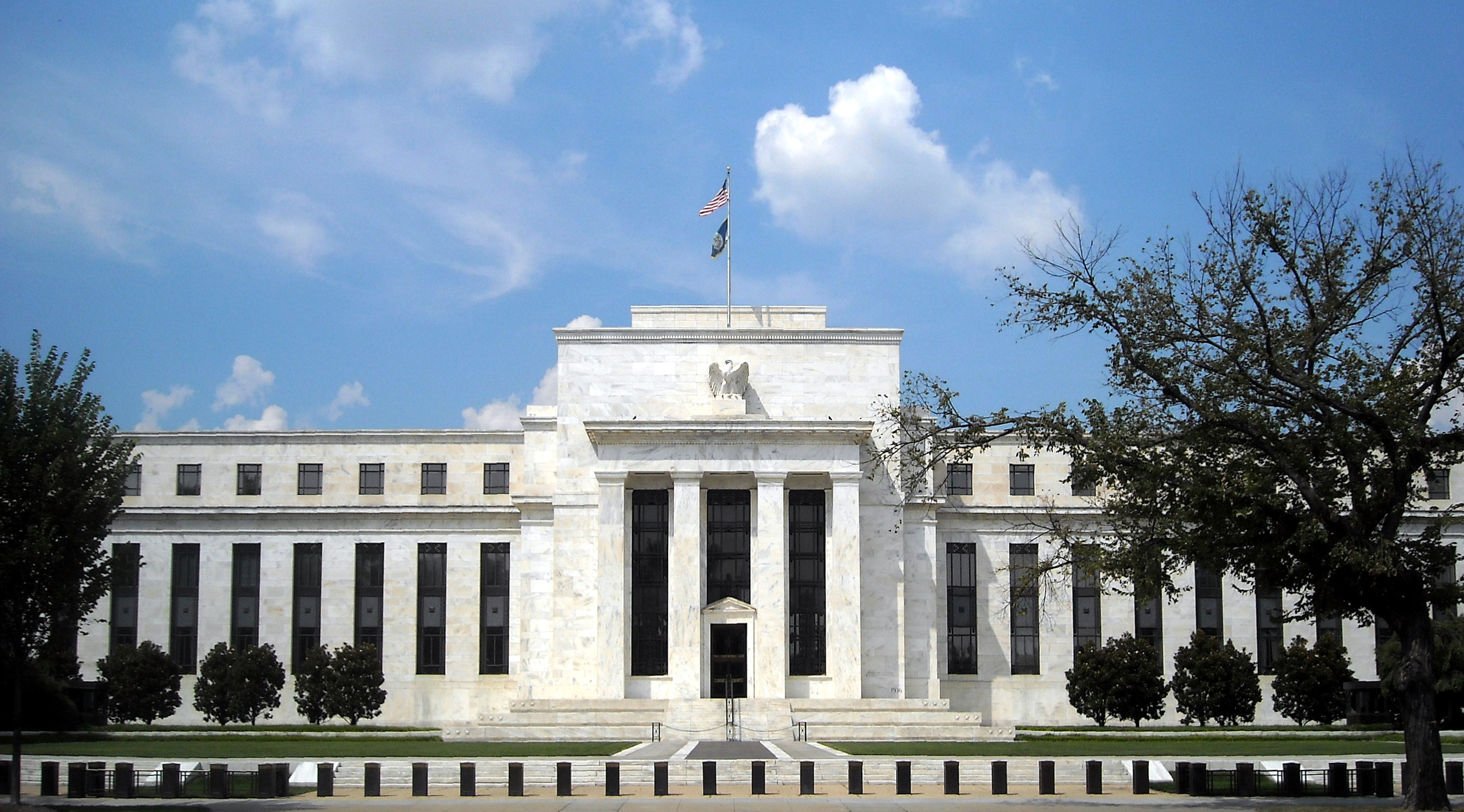 Street-level exterior view of the Marriner S. Eccles Federal Reserve Board Building in Washington, D.C.