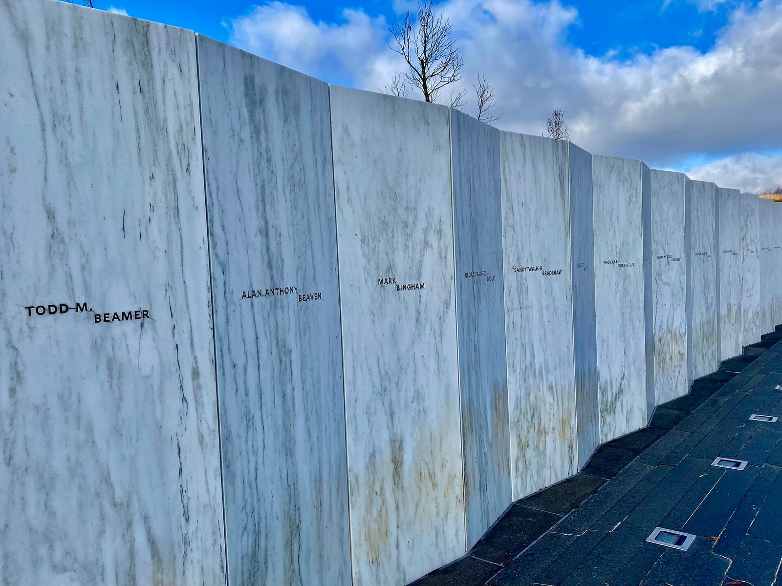 The Wall of Names at the Flight 93 National Memorial, a row of white marble panels inscribed with the names of the passengers and crew.