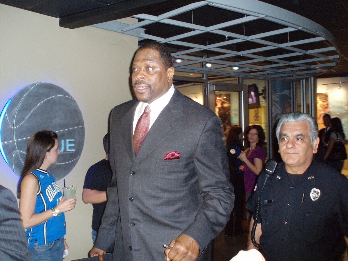 Patrick Ewing standing courtside in an Orlando Magic team jacket in 2008