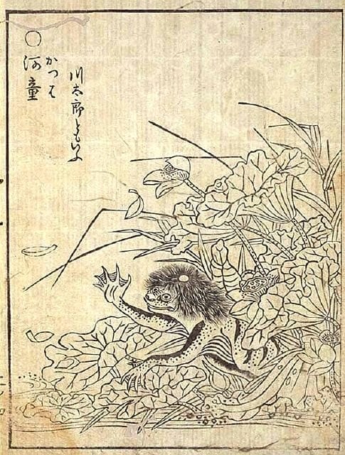 Edo-period Japanese woodblock illustration of a kappa, a beaked, turtle-shelled water creature emerging near reeds at the water's edge