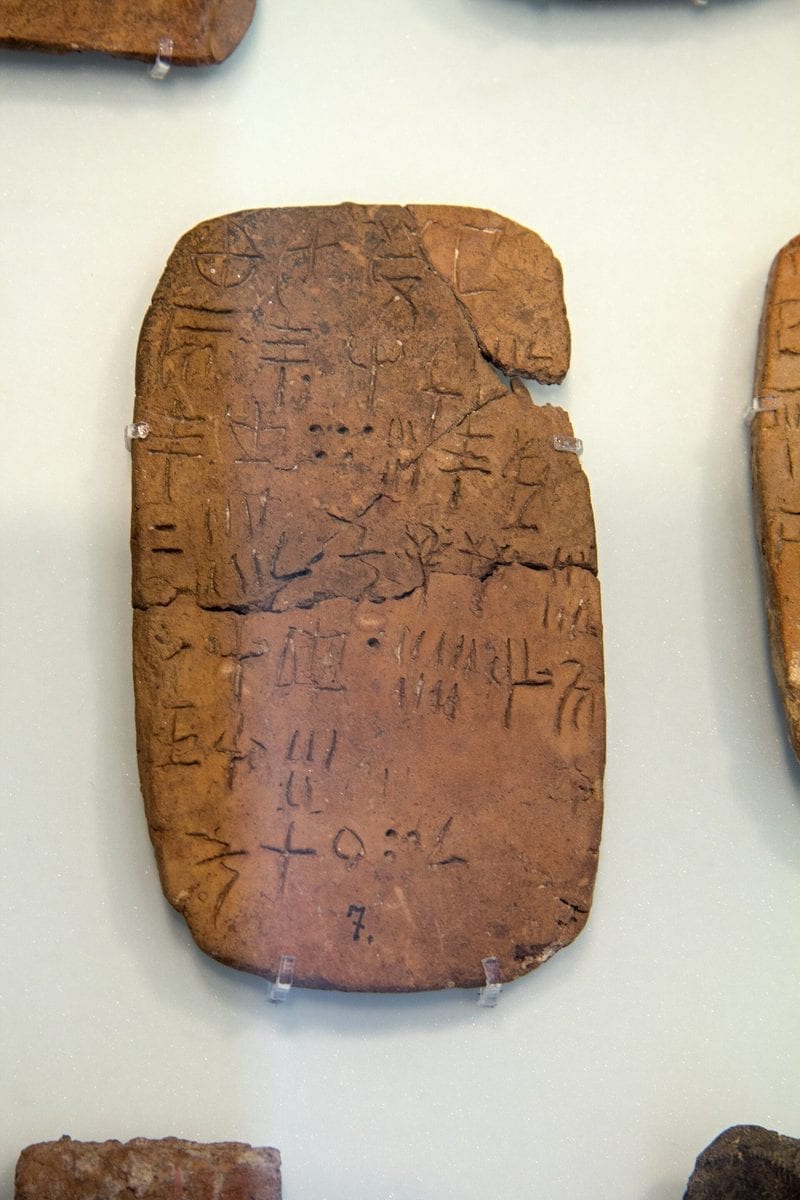 A Minoan artifact from Crete inscribed with signs of the undeciphered Linear A script, held in the Archaeological Museum of Heraklion.