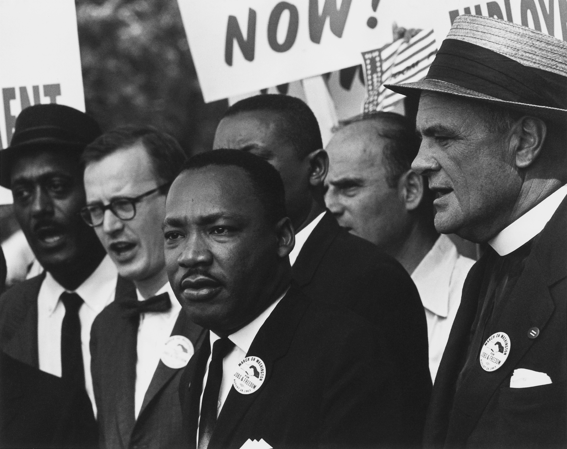 Dr. Martin Luther King Jr. standing among a crowd of demonstrators at the March on Washington on 28 August 1963