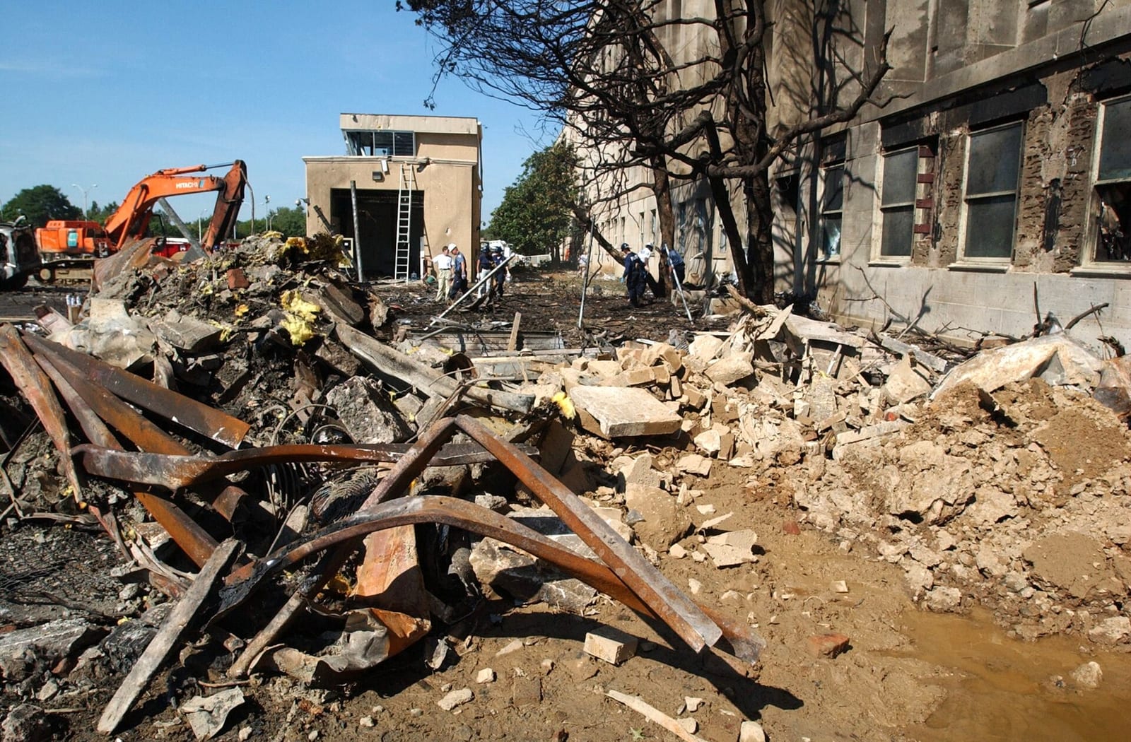 Aircraft debris scattered on the grass outside the Pentagon on 12 September 2001.