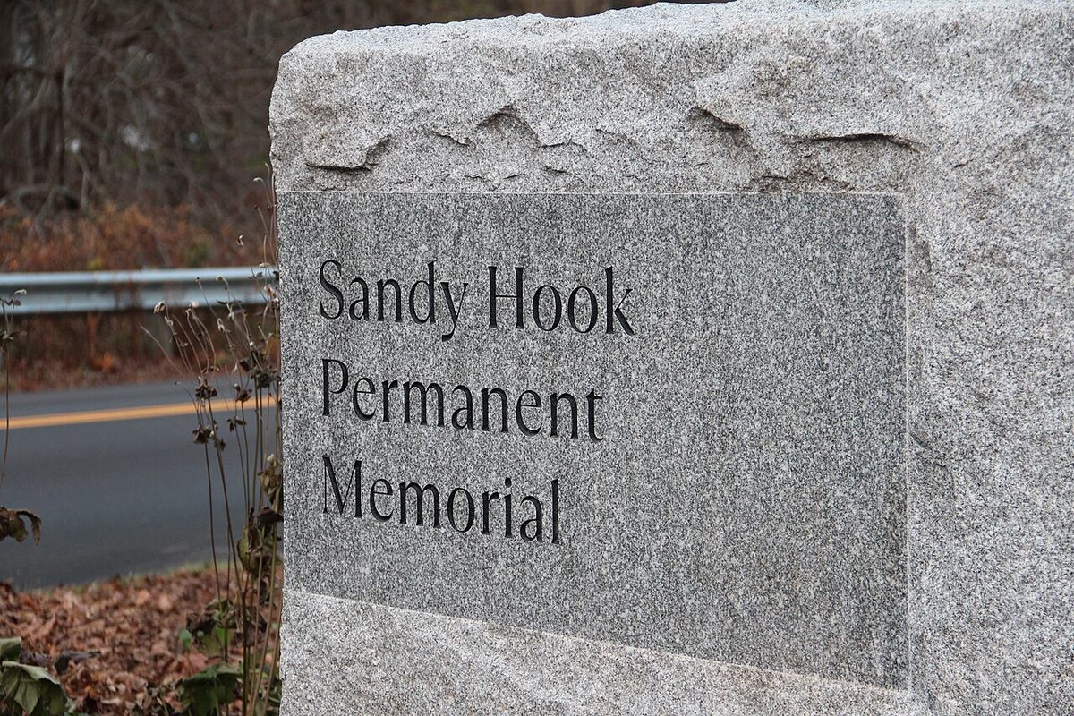 A granite marker engraved 'Sandy Hook Permanent Memorial,' at the memorial in Newtown, Connecticut.