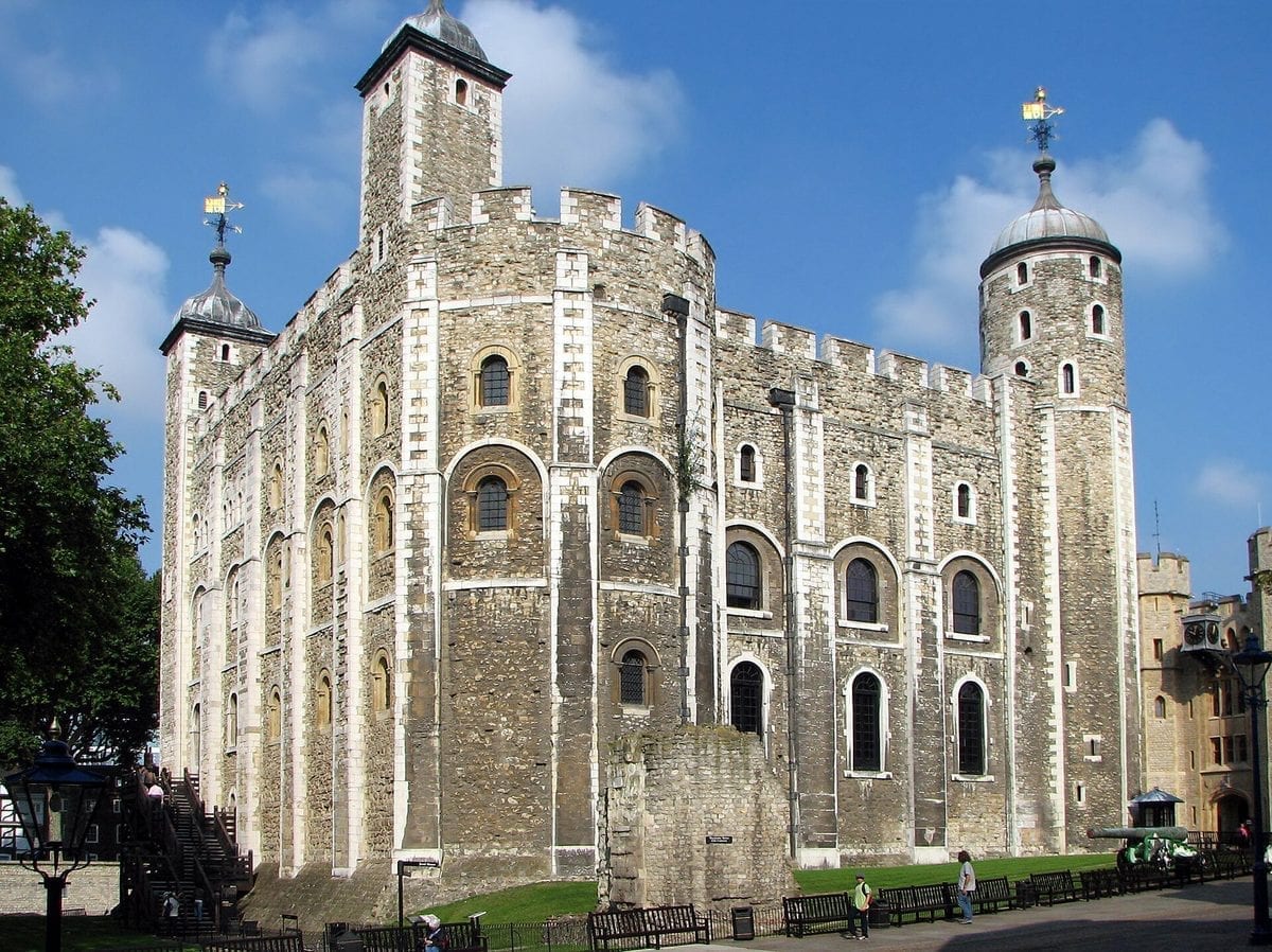 The White Tower, the stone Norman keep at the centre of the Tower of London, seen against a clear sky