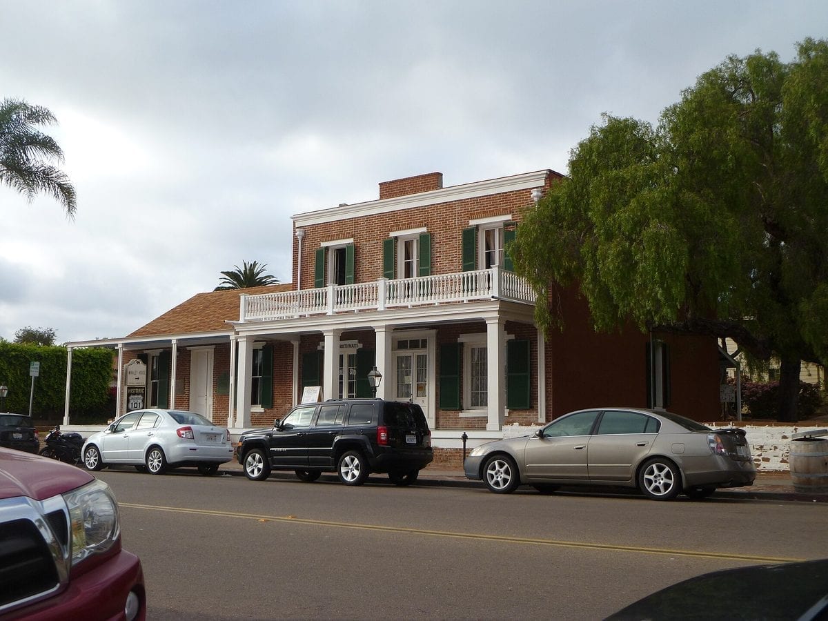 Exterior view of the two-story Greek Revival brick Whaley House in Old Town San Diego, California