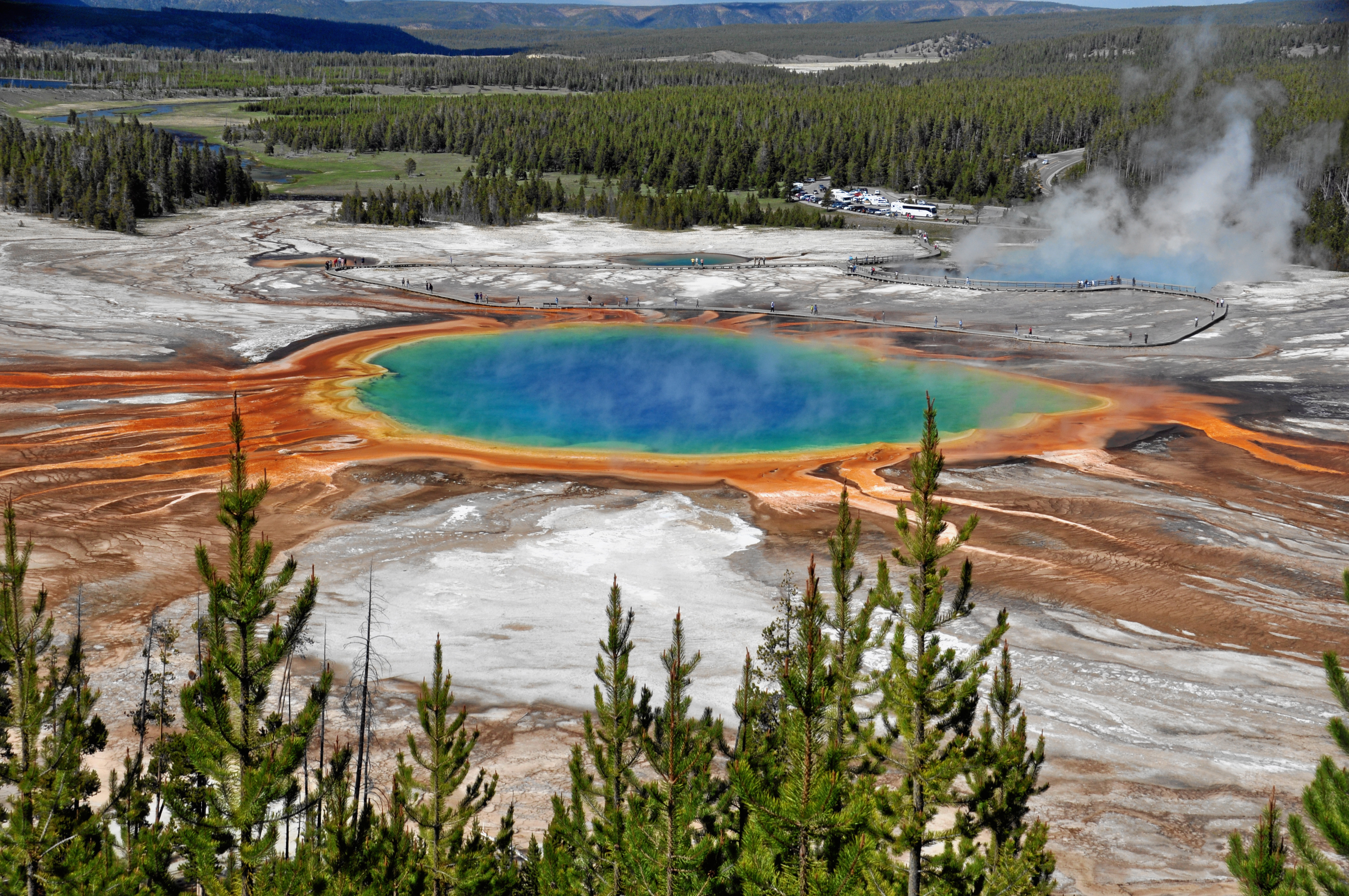 The vivid blue and orange Grand Prismatic Spring in Yellowstone's Midway Geyser Basin